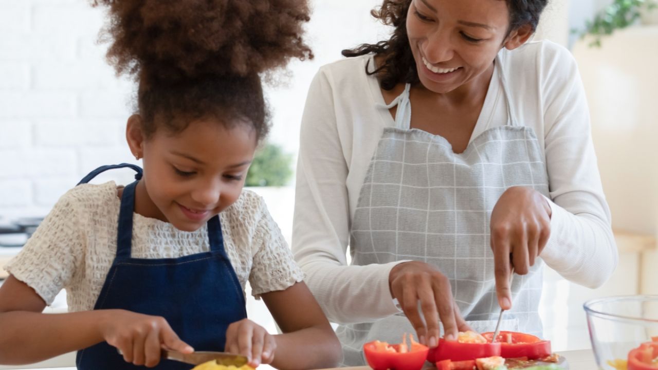 Mother and daughter cooking