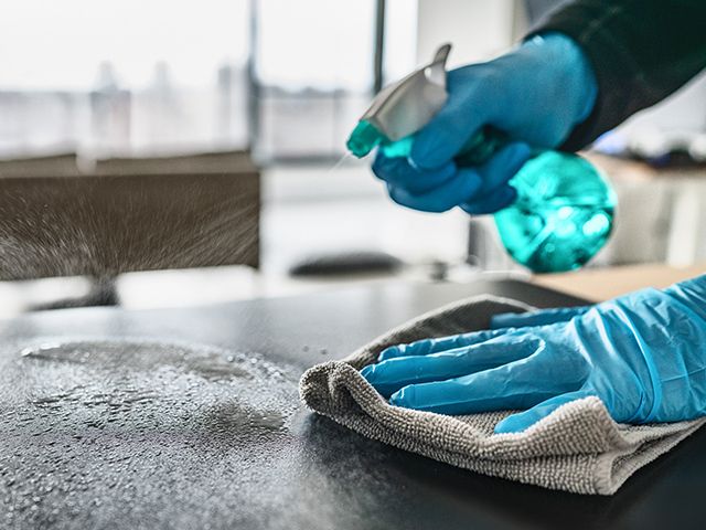 Cleaning spray being used on a table