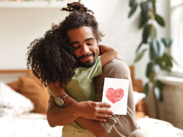 Daughter giving father gift