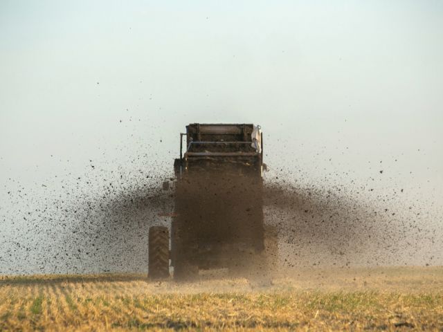 Manure spreader in field