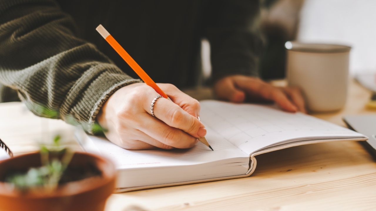 Person writing in a journal