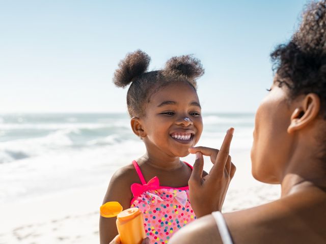 Applying sunscreen to a child